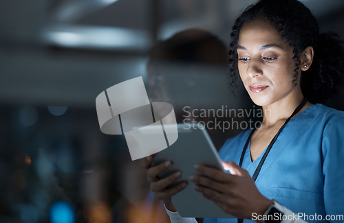 Image of Medical, research and night with doctor and tablet for planning, medicine and schedule. Technology, review and digital with black woman reading report for healthcare, science and life insurance news