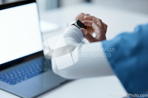 Image of Watch, healthcare and time with a woman nurse working late at night on a laptop in the hospital. Medical, smartwatch and overtime with a female medicine professional at work on a computer in a clinic