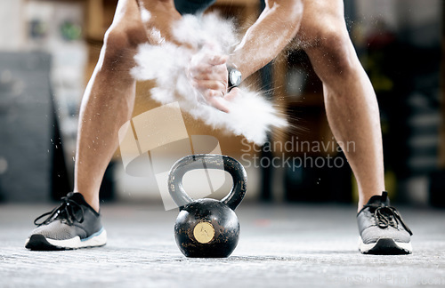 Image of Fitness, powder or hands with a kettlebell for training, workout or exercise with chalk dust for grip strength. Bodybuilder, mindset or healthy athlete with a heavy weight, motivation or focus at gym