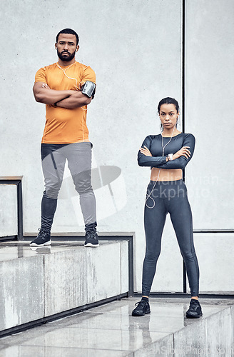 Image of Man, woman and fitness portrait with arms crossed on steps in city with for exercise, wellness and training in Atlanta. Two athletes standing ready for urban workout, sports goals and focus people