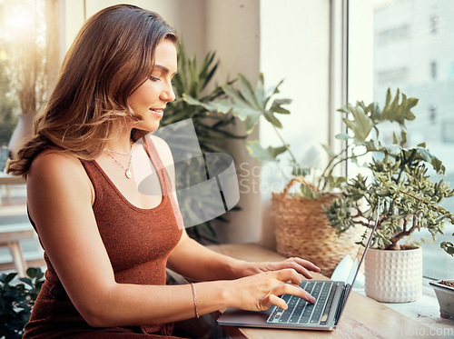 Image of Happy woman, laptop or typing in coffee shop, cafe or restaurant on internet blogging, internet research or learning course. Smile, entrepreneur or remote work on technology for freelance writing web