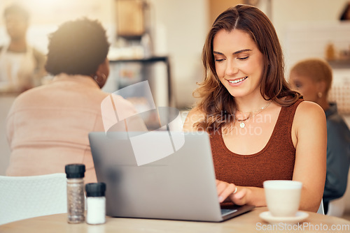 Image of Woman, typing and laptop in cafe of remote worker, planning freelance research or restaurant. Happy female, coffee shop and computer email technology on internet, blogging or social networking online