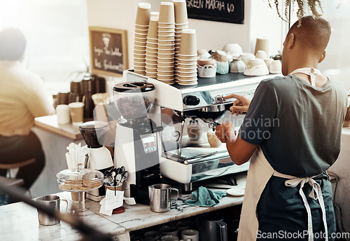 Image of Cafe barista, man and server at coffee machine to prepare espresso, latter or cappuccino. Back view, waiter and cafeteria worker pouring caffeine in restaurant, hospitality service and drinks order