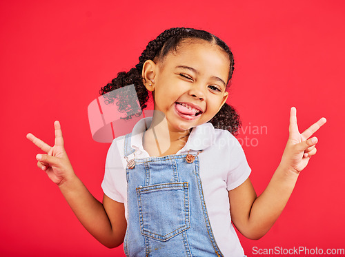 Image of Happy, peace sign and wink with portrait of girl for summer, happiness and funny face. Meme, fashion and smile with child and hand gesture for youth, comedy and positive in red background studio