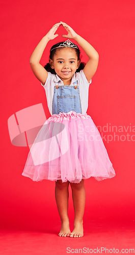 Image of Ballerina dance, portrait and child in princess dress for fantasy, red background and studio. Happy girl in ballet skirt, fairytale clothes and fashion crown with smile, playful energy and happiness