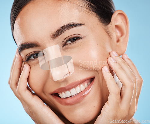 Image of Woman, skincare and beauty in closeup studio portrait with smile, happy or excited for cosmetic wellness. Model, natural skin glow or happiness for cosmetics, wellness or aesthetic by blue background