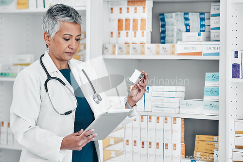 Image of Medicine, pharmacy and senior pharmacist doing research on pills and medication on a digital tablet. Reading, information and elderly female medical worker checking healthcare prescription at clinic.