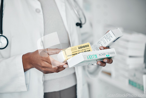 Image of Pharmacy, healthcare and hands with pills, medicine and and medication for prescription in clinic. Wellness, pharmaceutical service and black woman with product box for drugs, vitamins and treatment