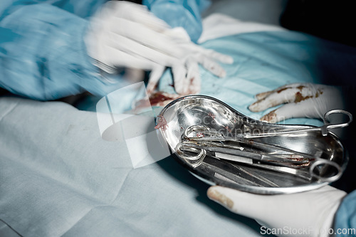 Image of Operation, blood and motion blur with doctors hands in a hospital for medical or life saving surgery. Healthcare, emergency or teamwork between a doctor and medicine team in a clinic ER theater