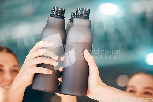 Image of Hands, fitness and cheers with bottle water for team training, exercise or workout achievement in sports. Hand of sport group celebration touching bottles for drinking, hydration or winning in unity