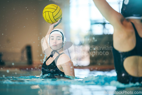Image of Water polo, sports and girl with ball in swimming pool for training, exercise and fitness with team. Professional sport, teamwork and female player with focus for winning game, competition and match