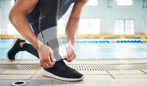 Image of Fitness, shoes and man getting ready for training, exercise or running with sports sneakers, fashion and energy. Feet of an athlete, runner or person tying his laces for cardio or workout motivation