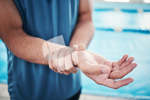 Image of Pain in wrist, sports and man by swimming pool with injury, muscle ache and arthritis inflammation. Wellness, medical care and hands of male with accident or bruise from fitness, exercise or training