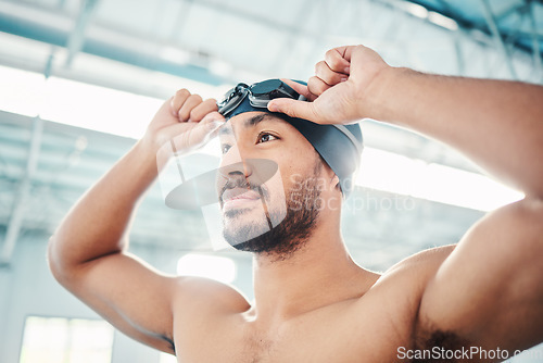 Image of Swimming athlete, man and start race, fitness and exercise at pool, motivation and active lifestyle. Water sports, determination and face with workout, training and health with wellness in sport