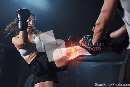 Image of Boxing, strong and leg of a woman with a trainer, inflammation and pain during cardio at the gym. Fitness, focus and girl kicking with a coach for exercise, workout and body power in a fighting ring