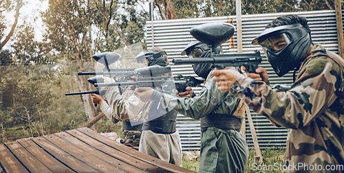 Image of Team, paintball and target practice at shooting range in preparation for extreme sports match or game outdoors. Group of people, soldiers or army aiming to shoot for training before sport competition