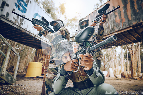 Image of Paintball teamwork, shooting together and war game with vision, mask or tactical strategy for safety in competition. Military training, team building and group with weapon, combat and friends outdoor
