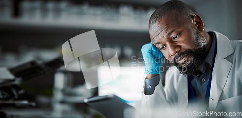 Image of Scientist man, stress and medical technology in a laboratory with a tablet and slow internet. Medical science person or doctor frustrated at desk for research with fatigue, burnout and mental health