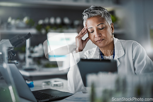 Image of Headache, tired and scientist woman in laboratory working on tablet for pharmaceutical research or data results. Mental health, fatigue and burnout senior, science person sad, stress or risk report