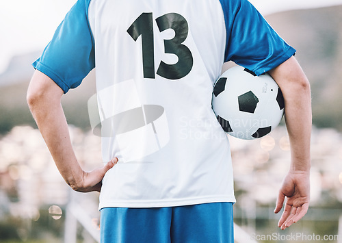 Image of Back, soccer and man with ball, training and ready for competition, wellness and healthy lifestyle. Football, male athlete and player prepare for match, practice and fitness for cardio and endurance