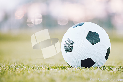 Image of Soccer, ball and field ready for game time or match start in sports, athletics or tournament in the outdoors. Round sphere object with pentagon shape spots on green grass for playing sport on mockup