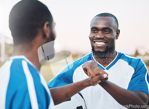 Image of Fist bump, soccer athlete and man with teamwork success of sports training on a grass field. Football friends, support and exercise support with motivation outdoor for health workout and smile