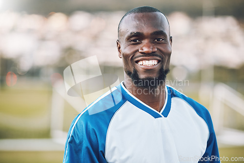 Image of Sports, football and portrait of black man with smile on field and motivation for winning game in Africa. Confident, proud and face of happy professional soccer player at exercise or training match.