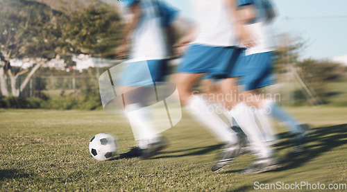 Image of Men, football team and running fast on field with motion blur for training, exercise and teamwork in sunshine. Group, soccer and dribbling together with speed for workout, strategy and sports tactics