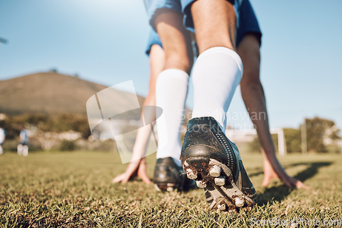 Image of Football player, shoes and start on field with sports and fitness outdoor, athlete legs and running in training session. Soccer, wellness and active lifestyle, professional sport man and team game