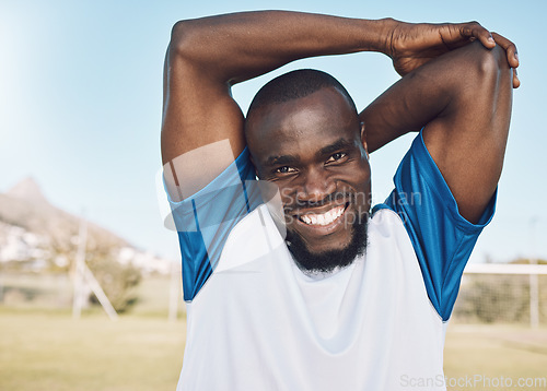 Image of Black man, soccer player and portrait of a athlete outdoor ready for exercise and fitness. Game workout, happy person and smile of a male feeling healthy from sports performance and runner goal