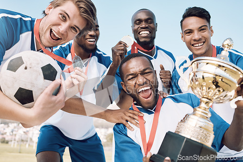 Image of Soccer, trophy and men team winning portrait at sports competition or game with teamwork on a field. Football champion group people with medal or prize for goal, performance and fitness achievement
