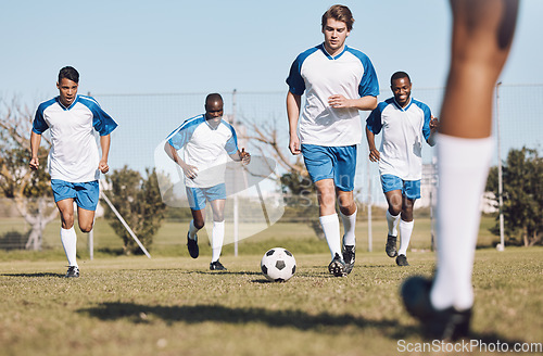 Image of Soccer, ball and men team running during sports competition, training or game with teamwork. Football group people on a grass field for a goal, cardio performance and fitness achievement outdoor