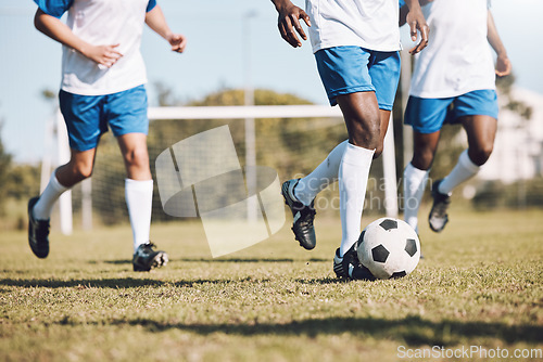 Image of Sports, running and men with a football on a field for training, competition and professional game. Teamwork, exercise and soccer players at a park for cardio, fitness action and workout in Brazil