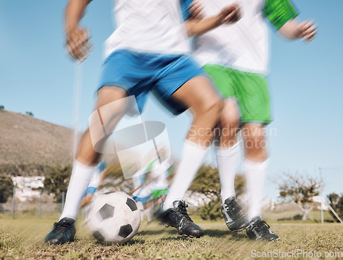 Image of Football, challenge and motion blur with a sports man running on a field during a competitive game or training. Soccer, fitness or health and a male athlete or player on a pitch with an opponent