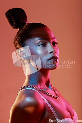 Image of Fashion aesthetic, beauty and face of woman in neon studio with makeup, designer jewellery and style. Cosmetics model, pink lighting and Latino girl with glamour, luxury accessories and glowing skin