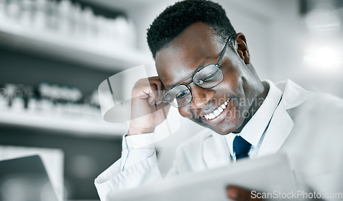 Image of Doctor, black man and tablet in lab for research, medical knowledge or happy for success, healthcare or career. Scientist, mobile touchscreen tech and focus for pharma innovation, motivation and goal