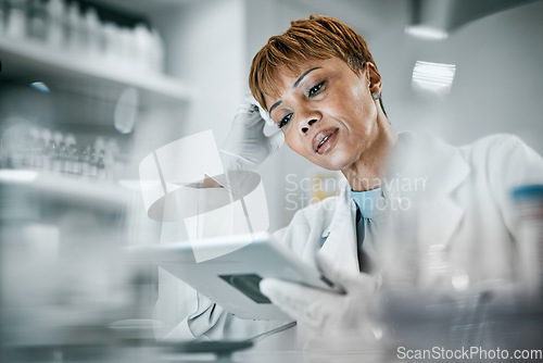 Image of Healthcare, science and black woman with tablet for research, medical analysis and experiment results. Medicine, laboratory and scientist with digital tech for data analysis, lab study and innovation