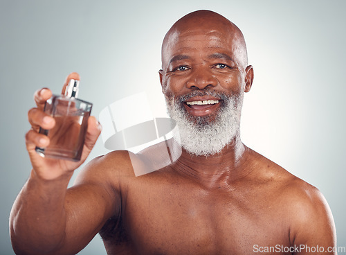 Image of Elderly black man, perfume and smile in portrait, beauty and skin, grooming and hygiene isolated on studio background. Happiness, wellness and skincare, cosmetic product and topless with fragrance