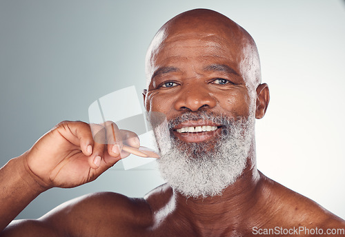 Image of Barber, grooming and beard with portrait of black man for beauty, hygiene and skincare. Self care, facial hair and comb with senior model for health, wellness and cleaning in studio background