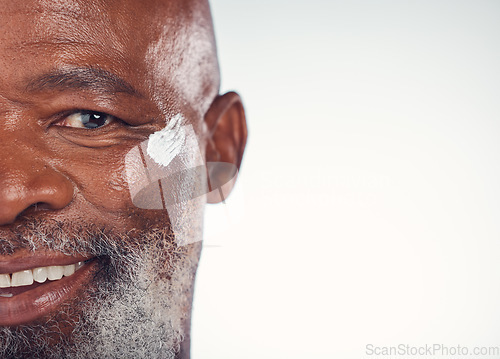 Image of Closeup, portrait and senior man with face cream in studio for skincare, beauty and grooming on white background. Facial, zoom and elderly model relax for luxury, cosmetic or wrinkle product isolated