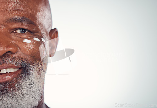 Image of Closeup, senior man and portrait with face cream in studio skincare, beauty and grooming on white background. Facial, zoom and elderly model relax with luxury, cosmetics and wrinkle product isolated