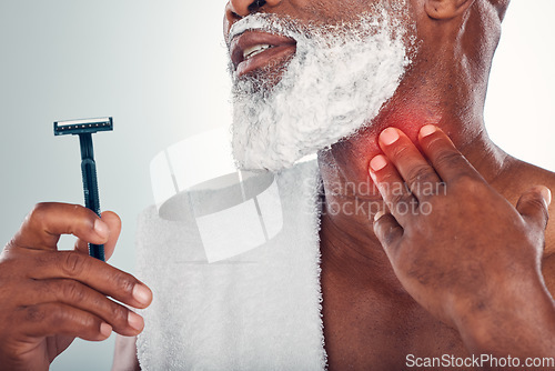 Image of Man, shaving and hand on neck for pain from razor burn or cut while grooming with foam on face. Bathroom beard shave accident, blade and injury on throat, old male model isolated on white background.