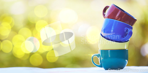 Image of Coffee, tea and mockup with stack of cup in park for catering, breakfast and health. Brunch, health and design with pile of porcelain mugs on table for fine dining, buffet and kitchenware in nature