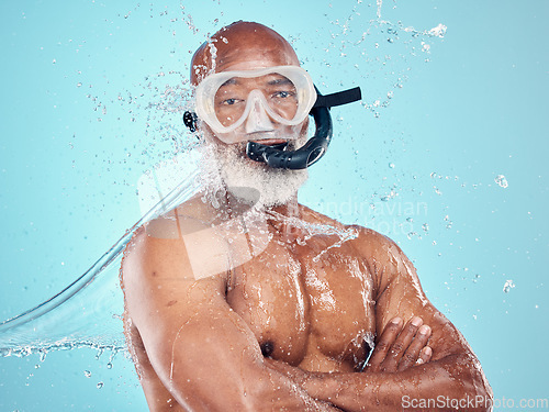 Image of Water splash, snorkel and skincare of black man in studio isolated on blue background. Wellness, cleaning or face portrait of senior male model with scuba mask, bathing or washing for healthy hygiene