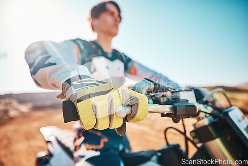 Image of Motorcycle, sports gear and hands of man for challenge, race and rally. Driver, bike gloves and ready for motorbike competition, performance and action of fearless adventure, power and start cycling