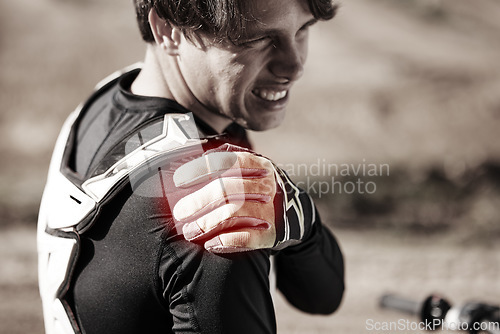 Image of Biker, man and shoulder pain after training, injury and inflammation with torn muscle, strain and outdoor. Male rider, athlete and sportsman with stiffness, accident and inflamed joint after practice