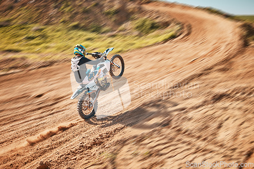 Image of Motorcycle athlete, dirtbike and motion blur for sports on sand trail for freedom. Driver, cycling and offroad competition, motorbike performance and adventure course for fast action, speed and risk