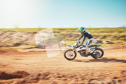 Image of Motorbike, motorcross and speed on sand trail with power, sunshine and sports rally. Driver, motorcycle and man travel on dirt track, adventure course and action for freedom, performance and talent