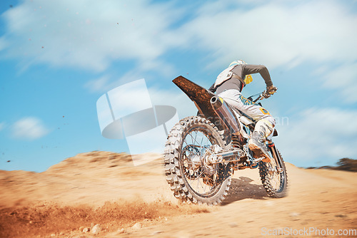 Image of Back of motorbike, offroad sports and speed on blue sky, desert sand or trail. Driver, cycling and power on dirt track, hill and motorcycle performance competition on adventure course for fast action