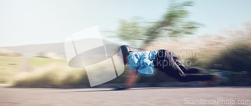 Image of Speed, skateboard and man in action on road ready for adventure, freedom and extreme sports motion blur. Training, skateboarding and skater with longboard for exercise, skating and fitness hobby
